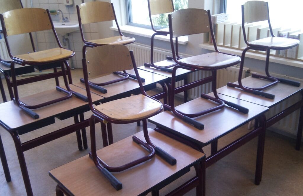 Empty classroom with rows of student desks