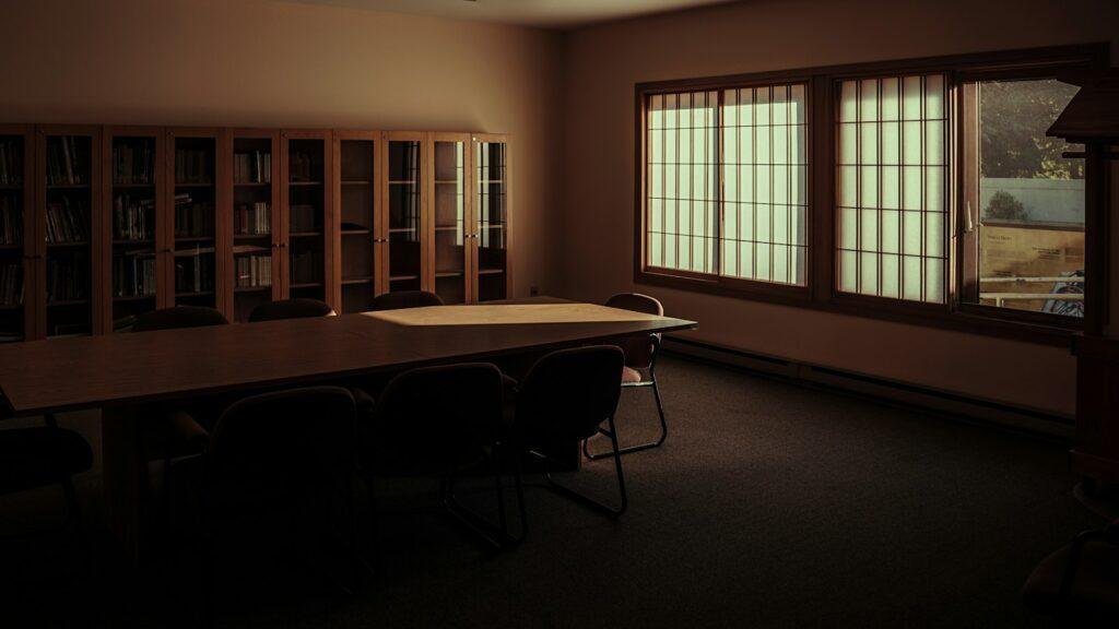 A quiet meeting room with a table and chairs