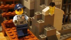 Lego bricks and a minifigure on a build plate