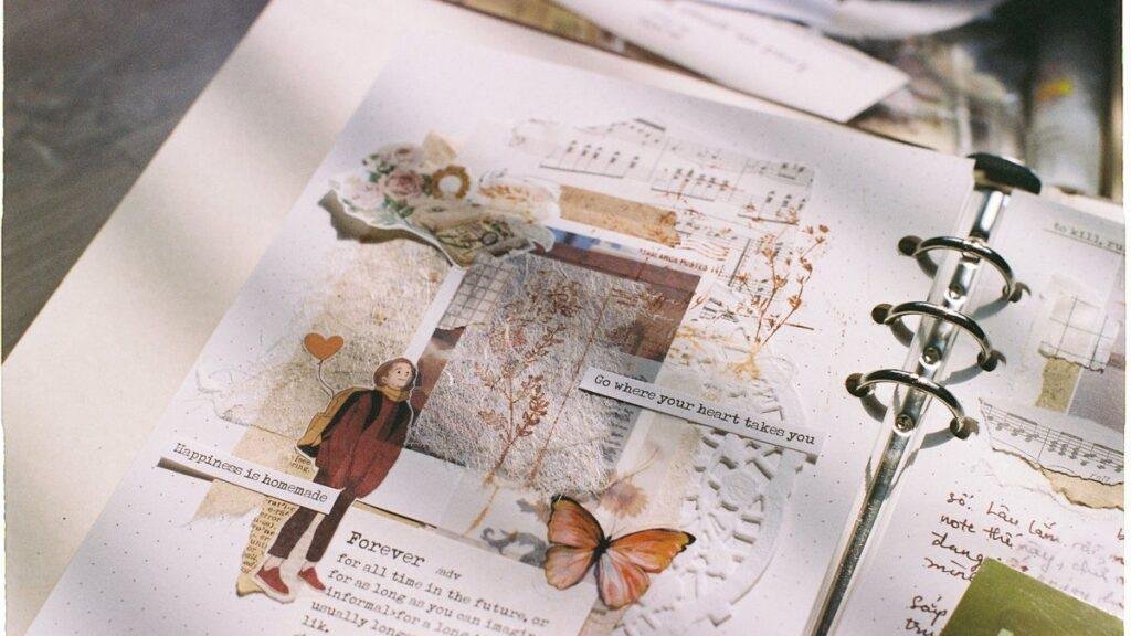 An open scrapbook page with pasted clippings and photos