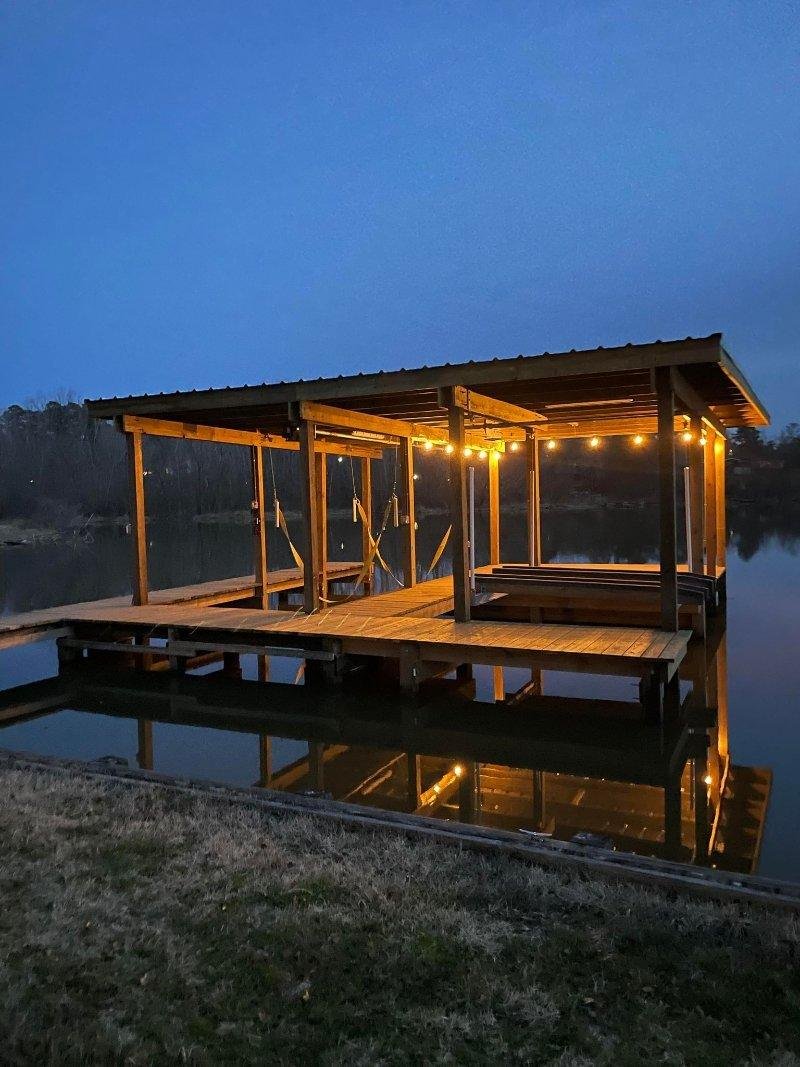 Boat dock with string lights wired by Piney Woods Electric