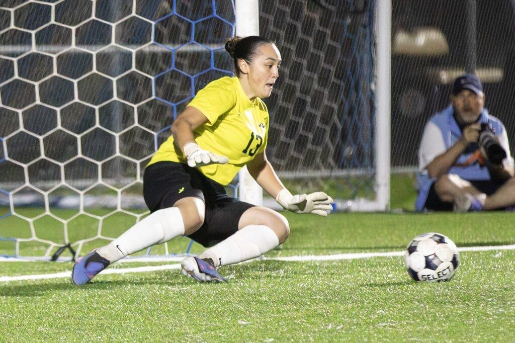 Angelina College goalkeeper Samuela Valeri dives left to stop Navarro College's final penalty kick in the Region XIV quarterfinal shootout at the Larry Phillips Family Sports Complex, Oct. 27, 2026.